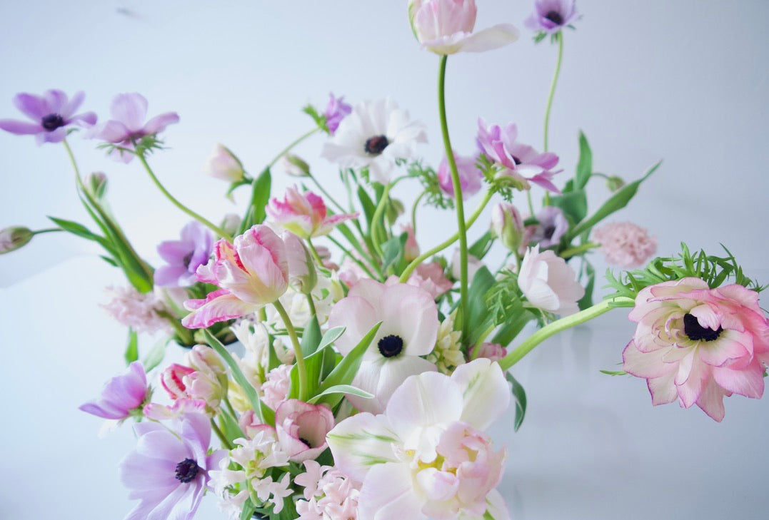 SMALL FLOWERS IN A VASE.