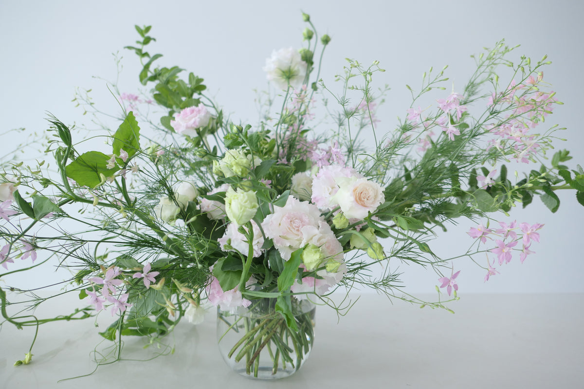 FLOWERS DESIGNED IN A VASE.