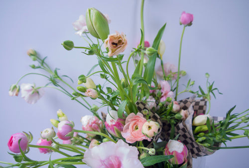 SMALL WRAPPED FLOWERS. NO VASE.