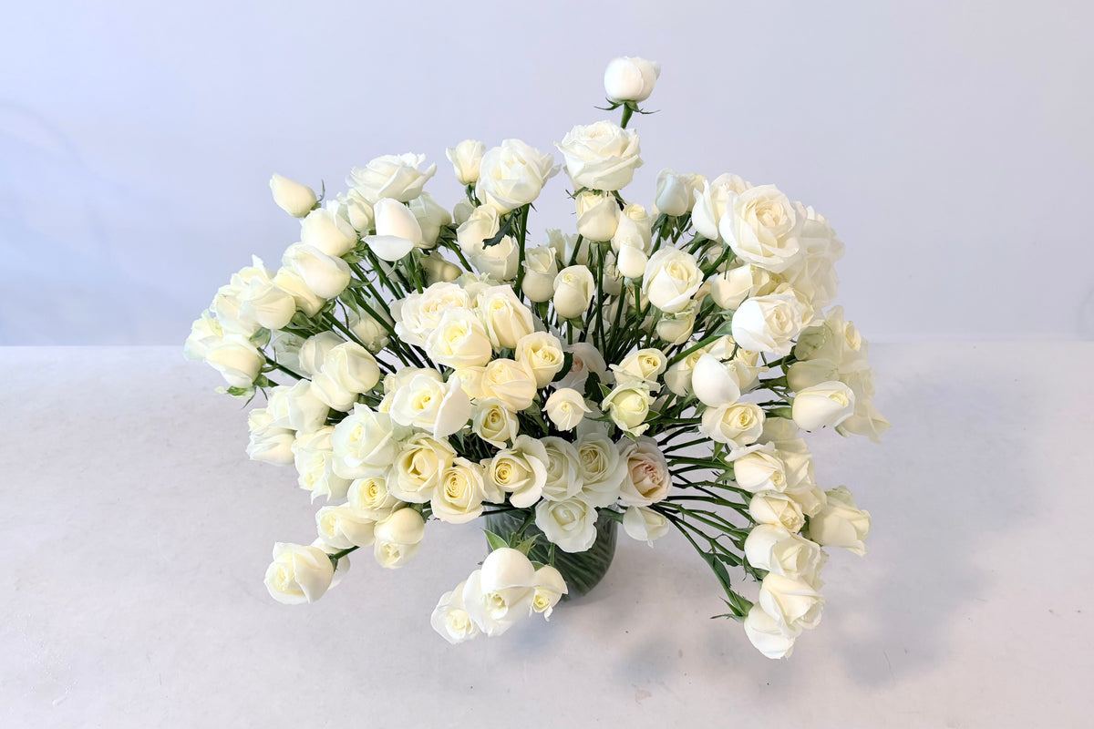 FLOWERS DESIGNED IN A VASE.