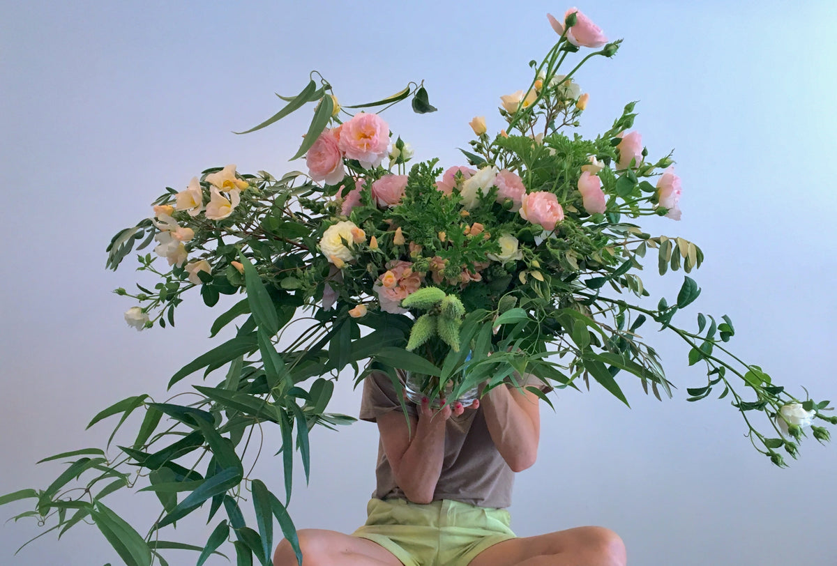 FLOWERS DESIGNED IN A VASE.