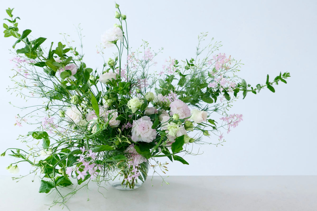 FLOWERS DESIGNED IN A VASE.